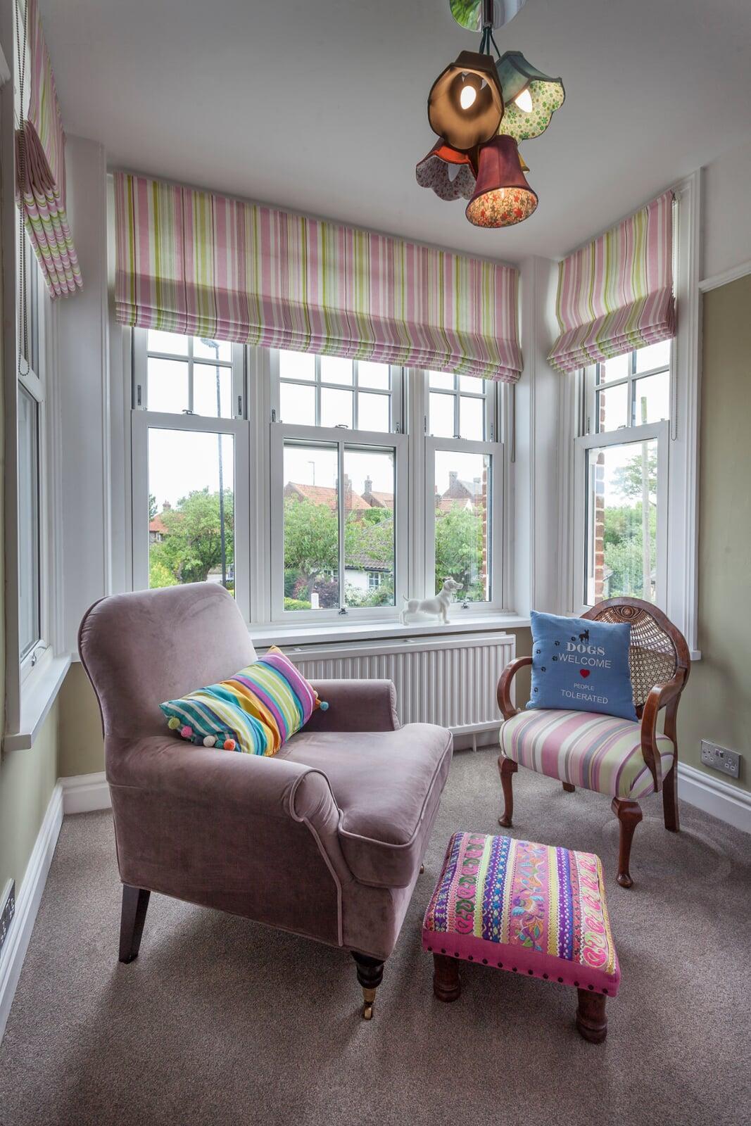 white PVC vertical sliding sash window with Georgian bars in period style living room