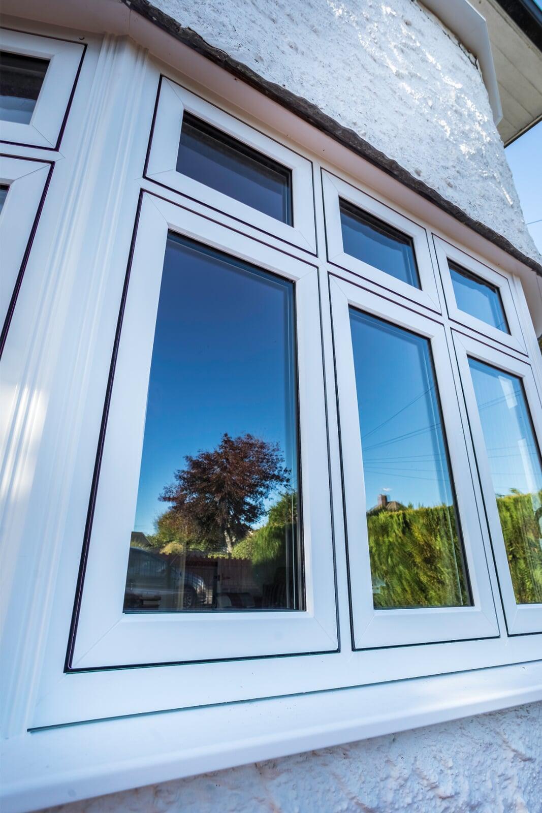 White Epwin flush casement PVC windows with slim sightlines on a modern property