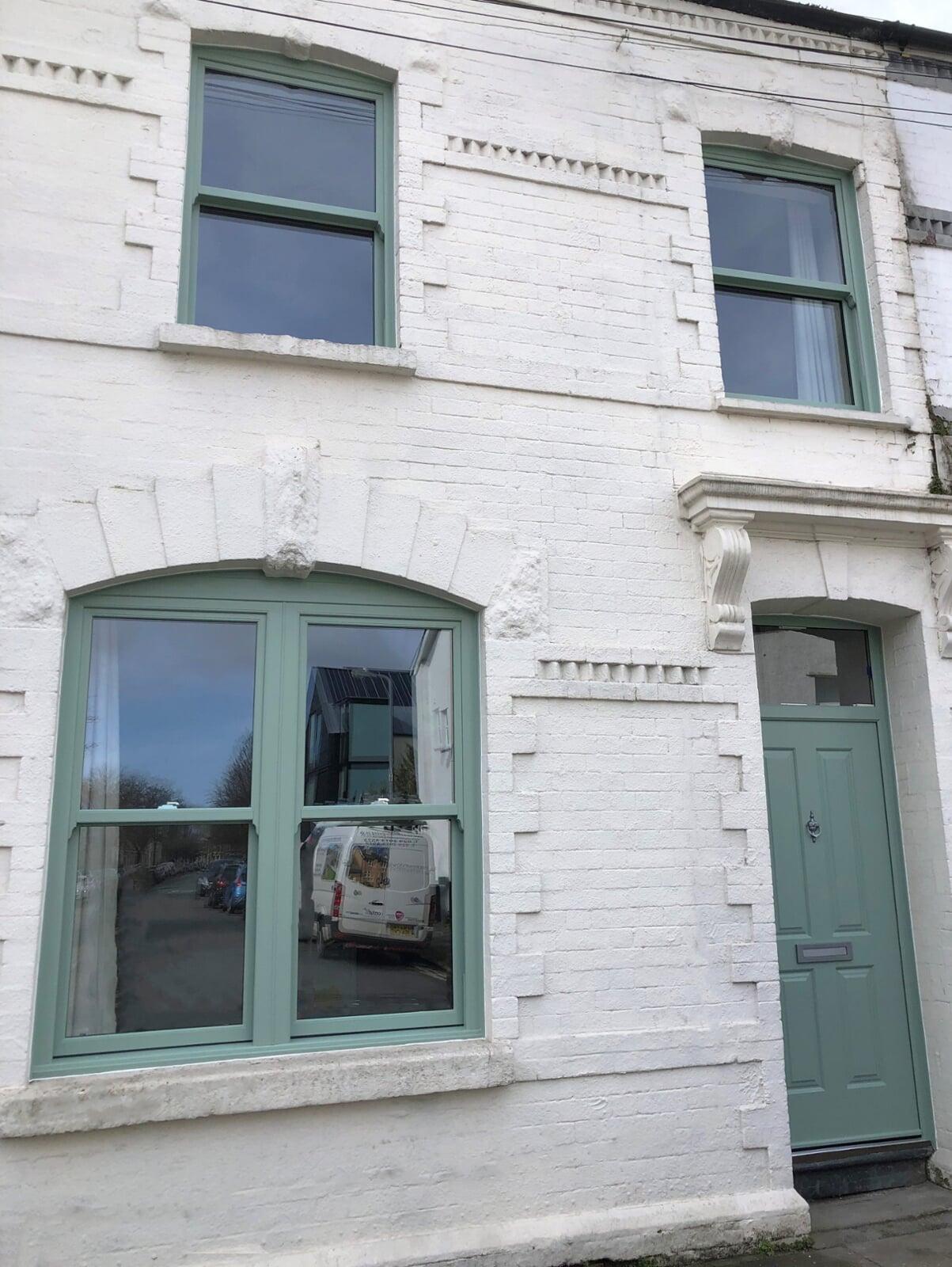 heritage style PVC sliding sash windows installed in period London terrace house