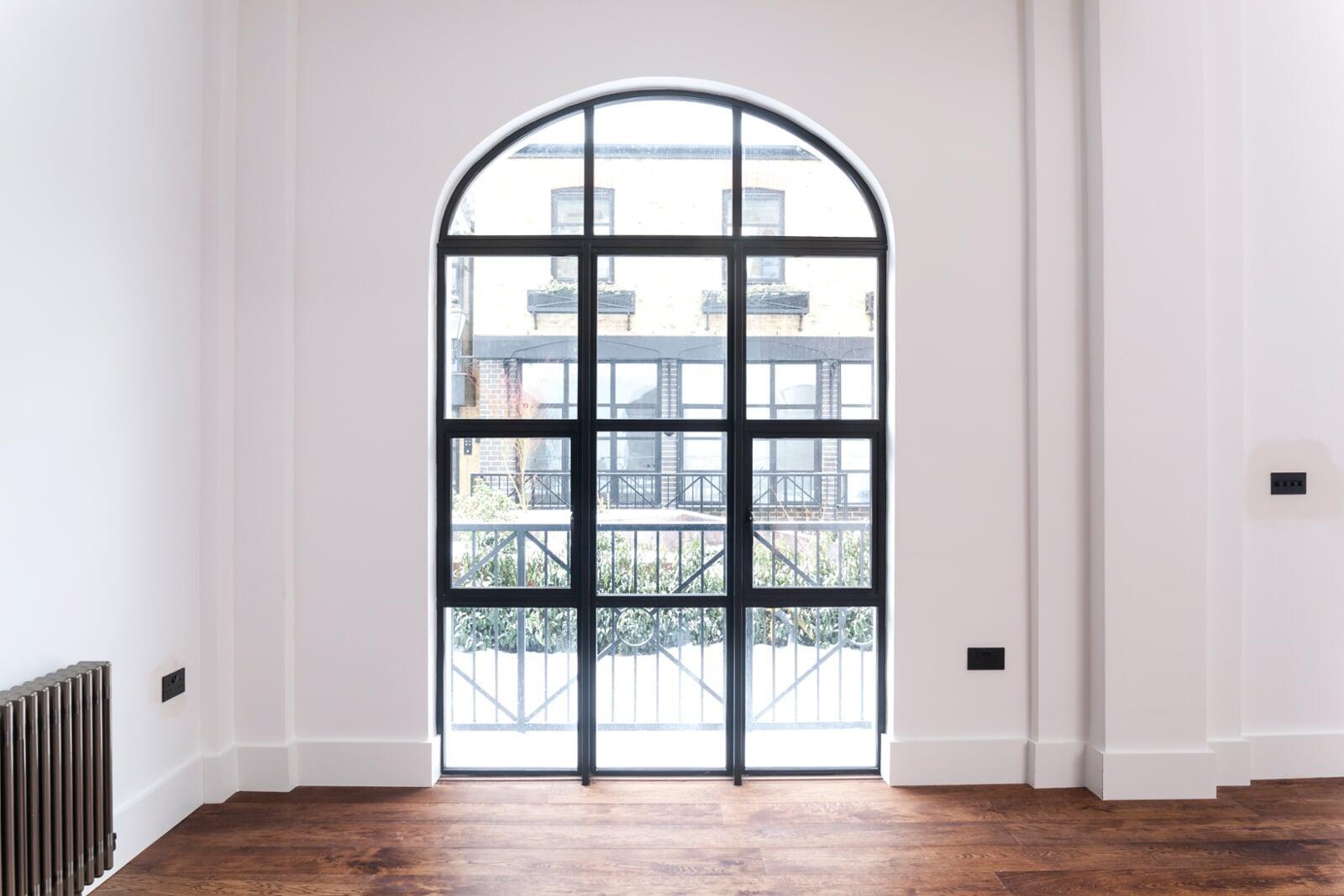 Heritage style arched aluminium window replicating traditional steel windows
