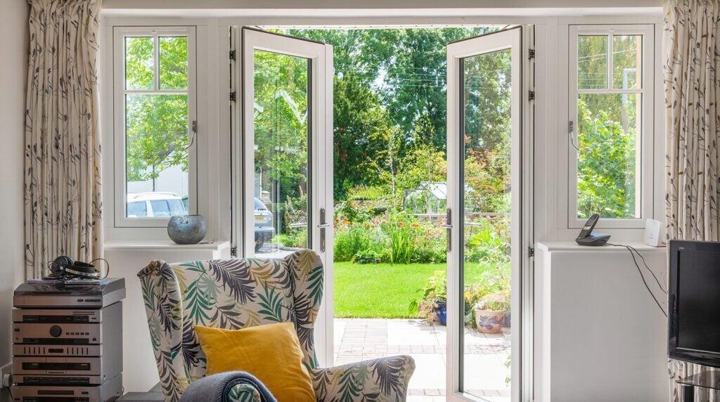 Residence RD entrance door viewed from inside with traditional glazing and garden view
