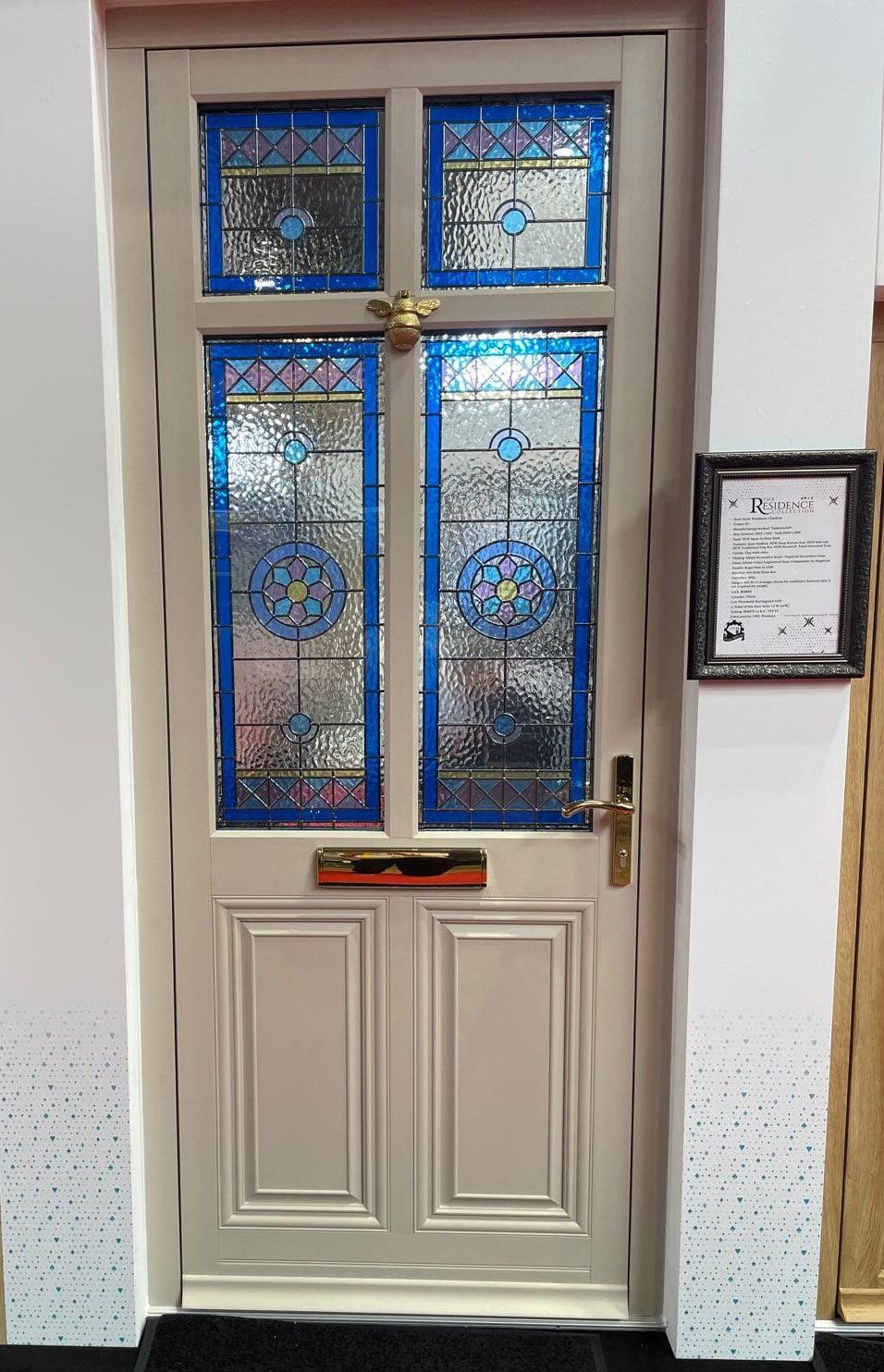 Residence RD front door with decorative stained glass panels in a traditional heritage design