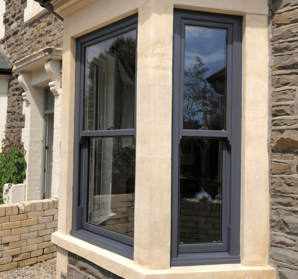 Sliding PVC sash windows installed in stone-built property